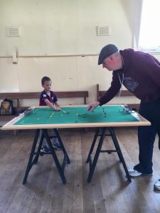 Adam (Right) in a friendly battle with his son, Aidan